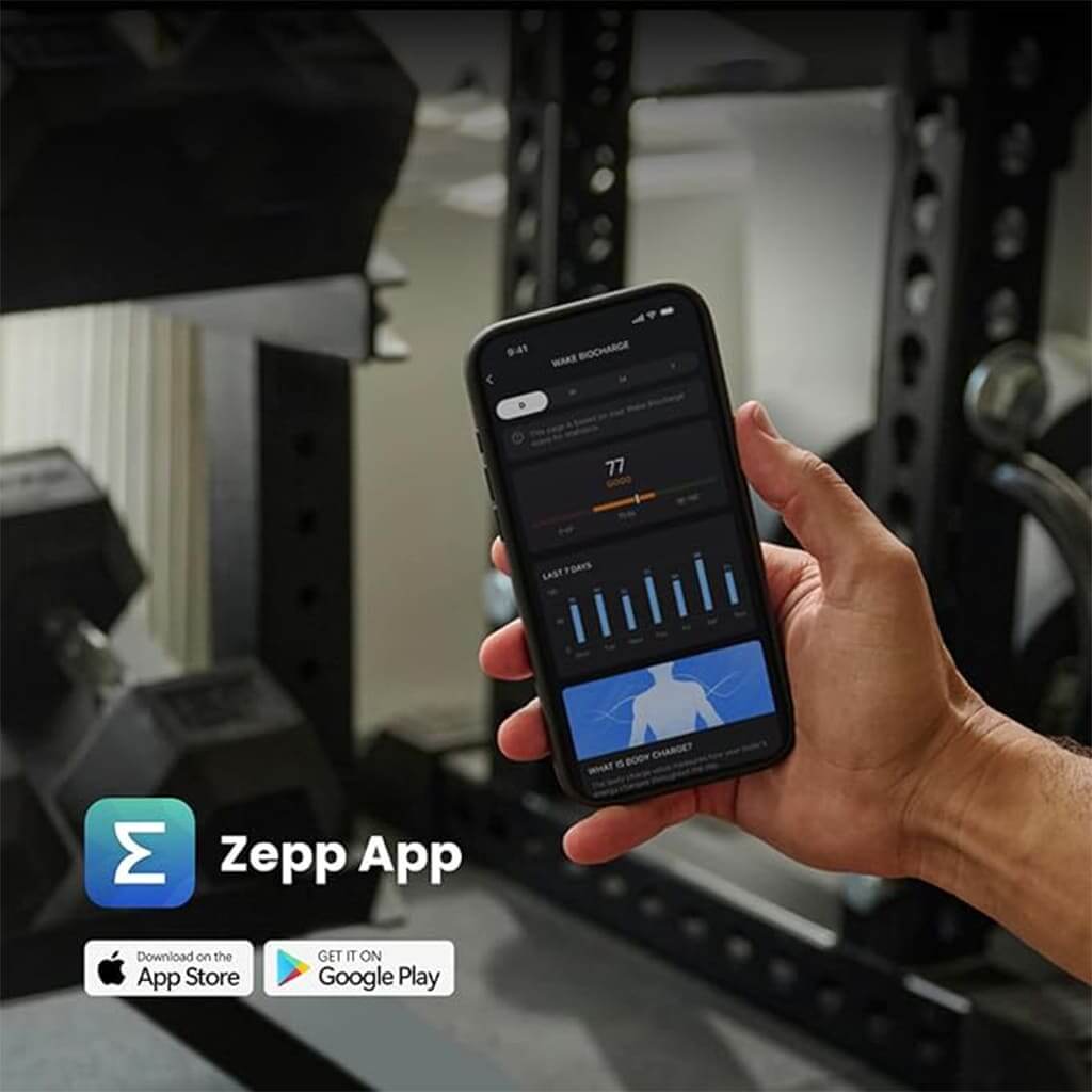 Hand holding smartphone showing Zepp app interface in a gym setting.